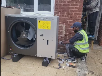 Trades professional installing equipment