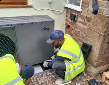 Trades professionals working on an installation